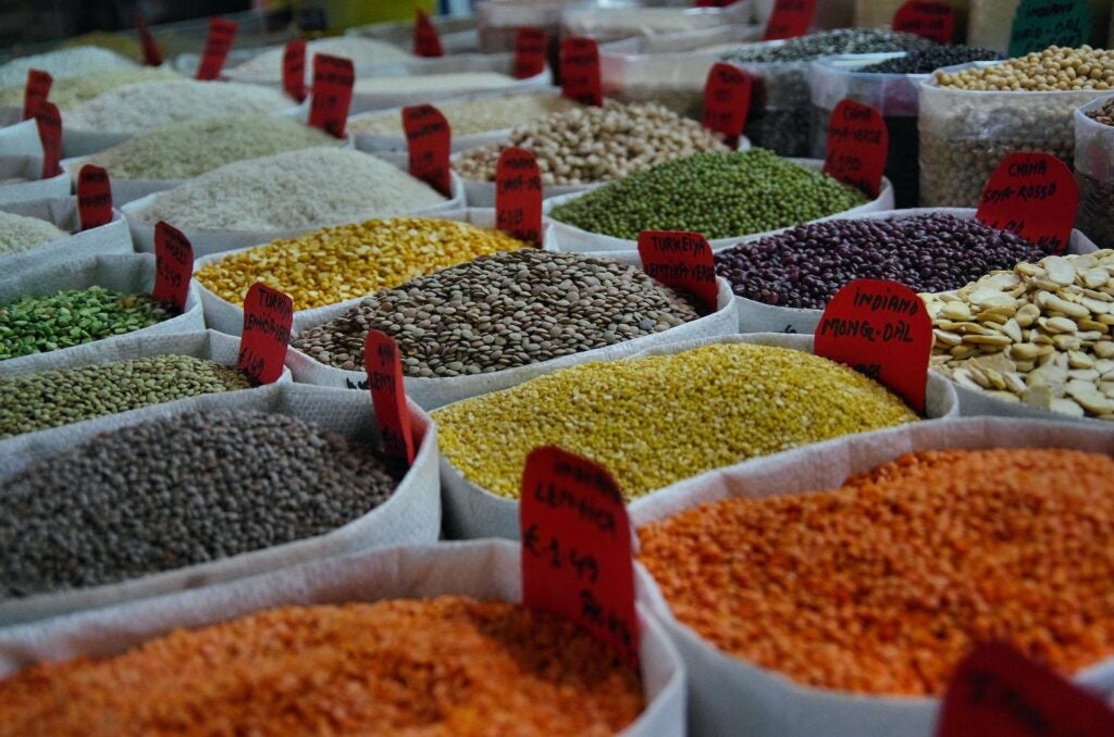 bags of lentils and grains at a market